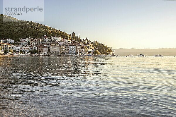 Beautiful historic skyline of a village on the Mediterranean  taken in the morning at sunrise on the beach and by the sea. Dreamlike harbour landscape in Mošcenicka Draga  Moscenicka Draga  Istria  Croatia  Europe