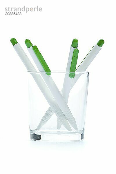 Green pens. Isolated on white. Selective focus