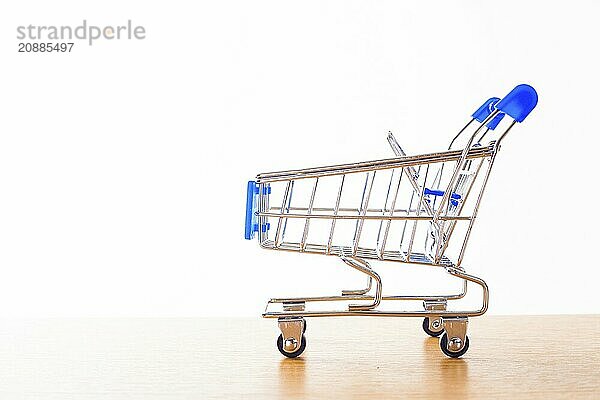 Shopping carts on the wooden floor. isolated on white