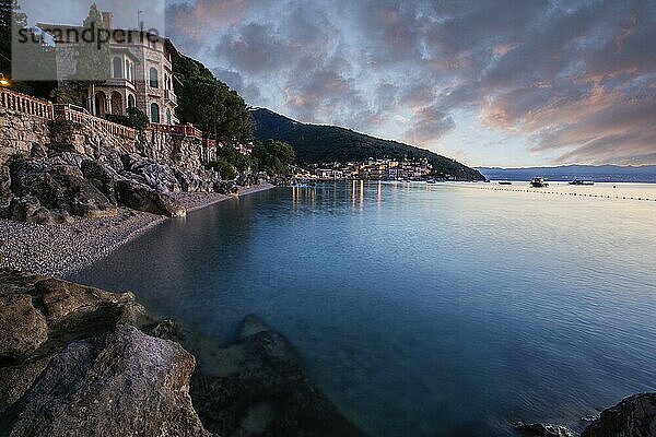 Beautiful historic skyline of a village on the Mediterranean  taken in the morning at sunrise on the beach and by the sea. Dreamlike harbour landscape in Mošcenicka Draga  Moscenicka Draga  Istria  Croatia  Europe