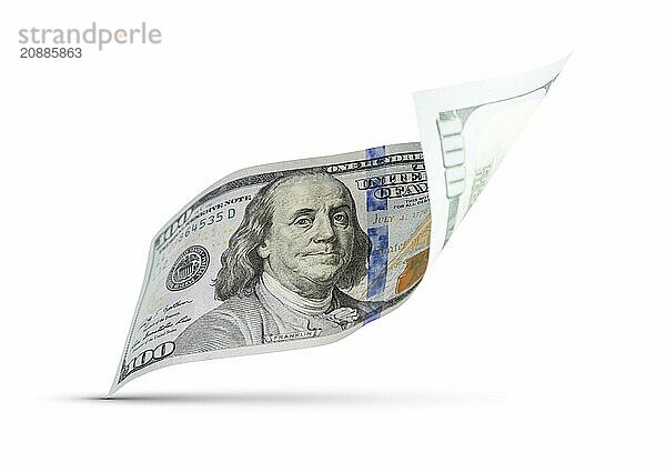 One hundred dollar bill floating down to surface with drop shadow isolated on a white background