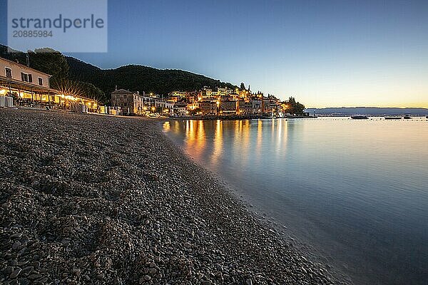 Beautiful historic skyline of a village on the Mediterranean  taken in the morning at sunrise on the beach and by the sea. Dreamlike harbour landscape in Mošcenicka Draga  Moscenicka Draga  Istria  Croatia  Europe