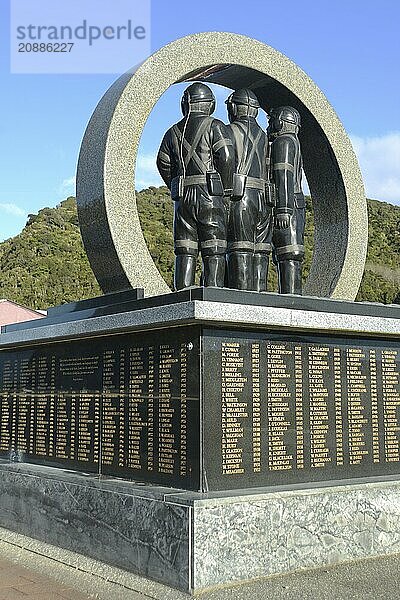 A memorial to coal miners lists the names of men killed in mining accidents in the Greymouth district since 1862. New Zealand  2022. The memorial depicts a mine portal with three miners dressed in work clothes