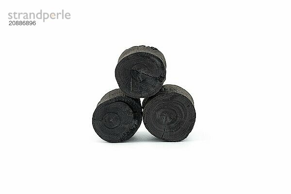 Natural wood charcoal isolated on white background. Pile of coal isolated on white background