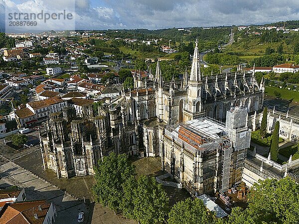 Gothic cathedral with cityscape in the background  some areas under construction  aerial view  monastery  Mosteiro de Santa Maria da Vitória  unfinished chapels  UNESCO World Heritage Site  Batalha  Leiria  Estremadura  Portugal  Europe