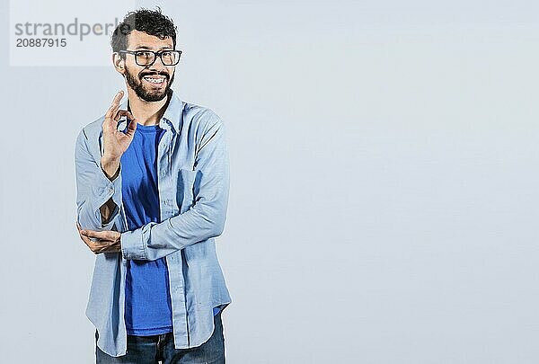 Man gesturing everything is ok isolated. Smiling man showing ok gesture looking at camera  expression of everything is fine