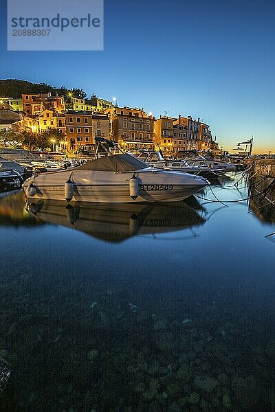 Beautiful historic skyline of a village on the Mediterranean  taken in the morning at sunrise on the beach and by the sea. Dreamlike harbour landscape in Mošcenicka Draga  Moscenicka Draga  Istria  Croatia  Europe