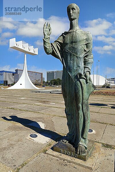 St John the Evangelist statue by Alfredo Ceschiatti and Dante Croce in front of the bell tower of Roman Cathedral of Brasília or Metropolitan Cathedral  designed by Oscar Niemeyer  World Heritage Site  Brasilia  Federal district  Brazil  South America