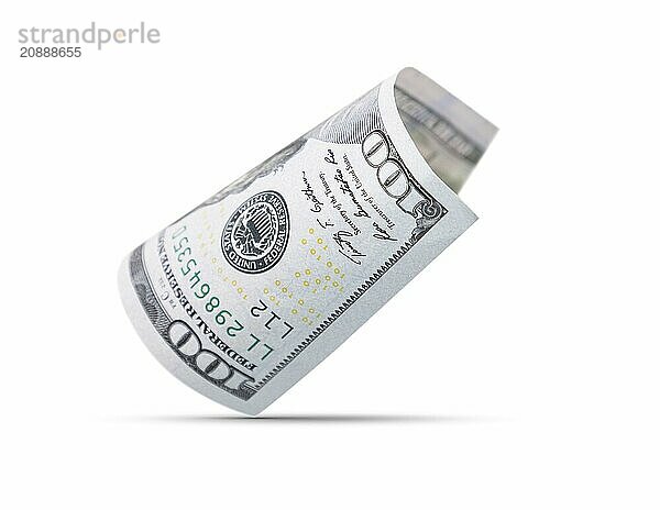 One hundred dollar bill floating down to surface with drop shadow isolated on a white background