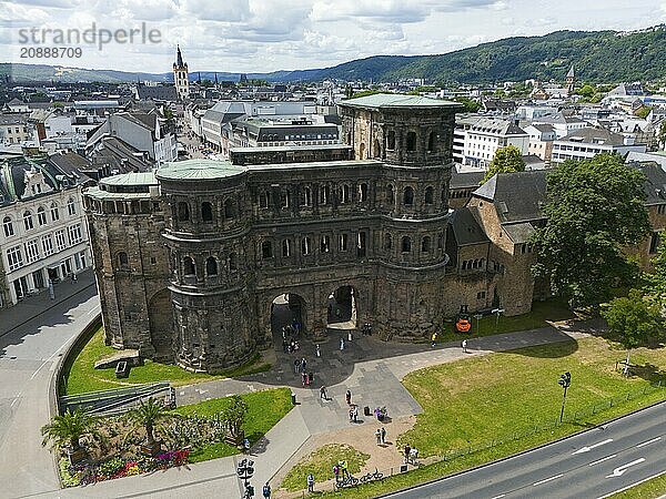 Historical architecture of the Porta Nigra with city panorama  surrounded by mountains and green areas  aerial view  Porta Nigra  Black Gate  Roman city gate  Trier  Rhineland-Palatinate  Germany  Europe