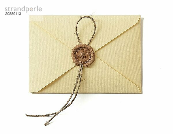 Envelope with seal isolated on white. Closeup