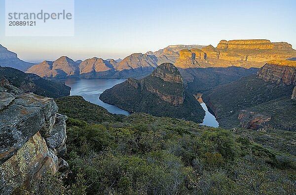 Sunset at Blyde River Canyon with Three Rondawels peak  view of canyon with Blyde River and table mountains in the evening light  canyon landscape  Panorama Route  Mpumalanga  South Africa  Africa