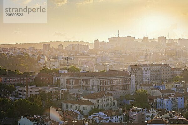 View of Lisbon famous view from Miradouro da Senhora do Monte tourist viewpoint in contre-jou on sunset. Lisbon  Portugal  Europe