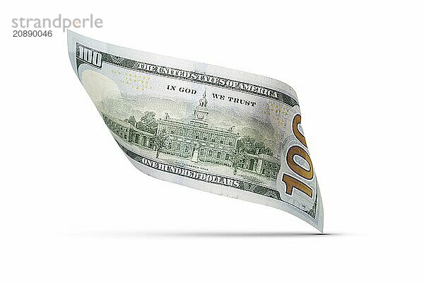 One hundred dollar bill floating down to surface with drop shadow isolated on a white background