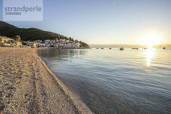 Beautiful historic skyline of a village on the Mediterranean  taken in the morning at sunrise on the beach and by the sea. Dreamlike harbour landscape in Mošcenicka Draga  Moscenicka Draga  Istria  Croatia  Europe