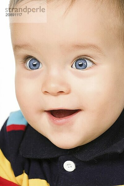 The blue-eyed baby  close-up. Isolated on white