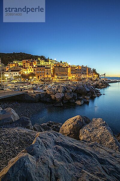 Beautiful historic skyline of a village on the Mediterranean  taken in the morning at sunrise on the beach and by the sea. Dreamlike harbour landscape in Mošcenicka Draga  Moscenicka Draga  Istria  Croatia  Europe