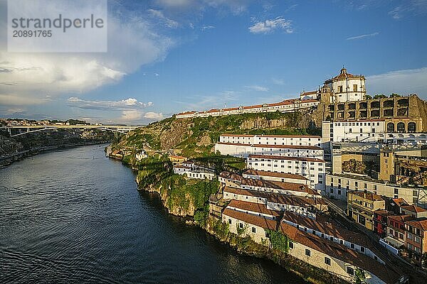 View of Vila Nova de Gaia city with Mosteiro da Serra do Pilar monastery and Douro river on sunset. Porto  Vila Nova de Gaia  Portugal  Europe