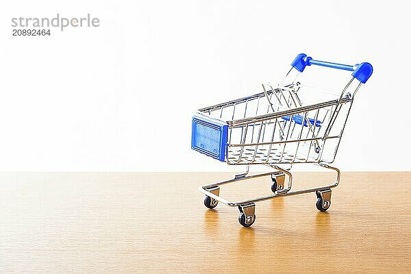 Shopping carts on the wooden floor. isolated on white