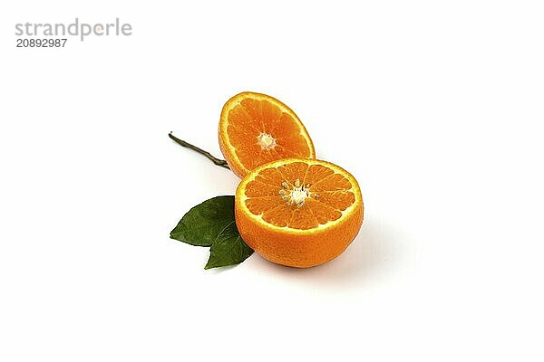 An orange fruit  orange slices  and orange leaves are isolated on a white background