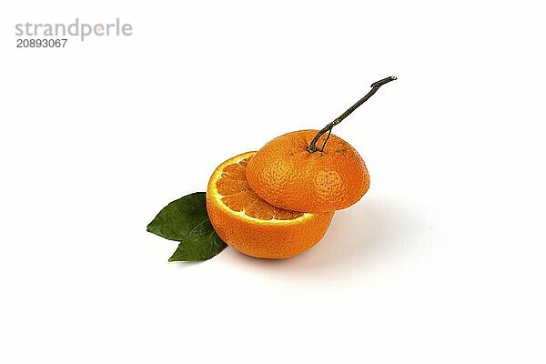 An orange fruit  orange slices  and orange leaves are isolated on a white background