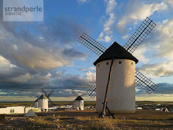 Several windmills in an open landscape  illuminated by sunlight  under a cloudy sky  windmills  Campo de Criptana  Ciudad Real province  Castilla-La Mancha  Route of Don Quixote  Spain  Europe