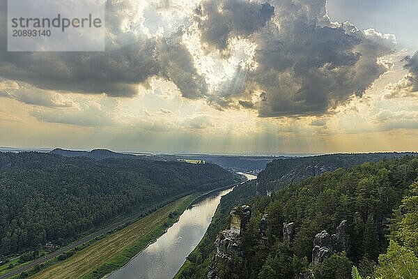 The Bastei is a rock formation with a viewing platform in Saxon Switzerland on the right bank of the River Elbe in the municipality of Lohmen between the spa town of Rathen and the town of Wehlen. It is one of the most visited tourist attractions in Saxon Switzerland. Dramatic sky over the Bastei  Saxon Switzerland  Rathen  Saxony  Germany  Europe