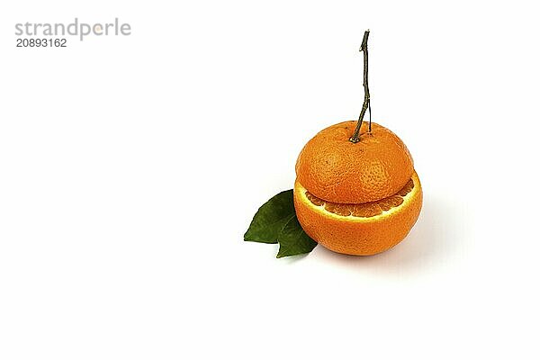 An orange fruit  orange slices  and orange leaves are isolated on a white background