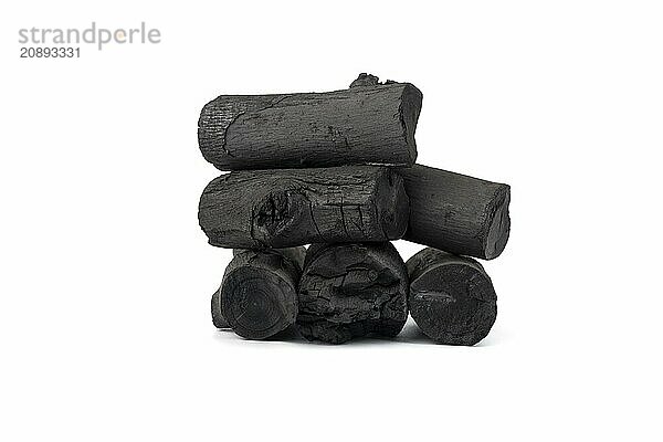 Natural wood charcoal isolated on white background. Pile of coal isolated on white background