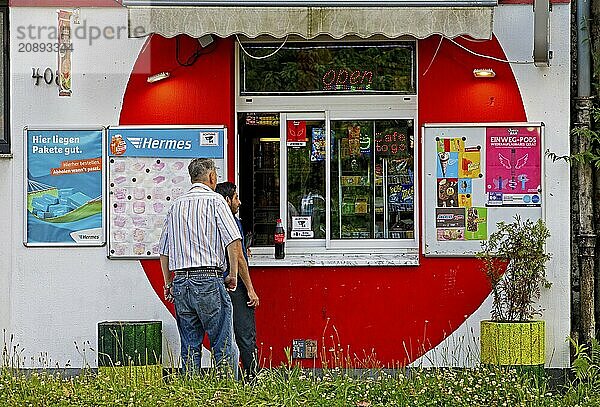 Two men at a kiosk  drinking hall  Dortmund  Ruhr area  North Rhine-Westphalia  Germany  Europe