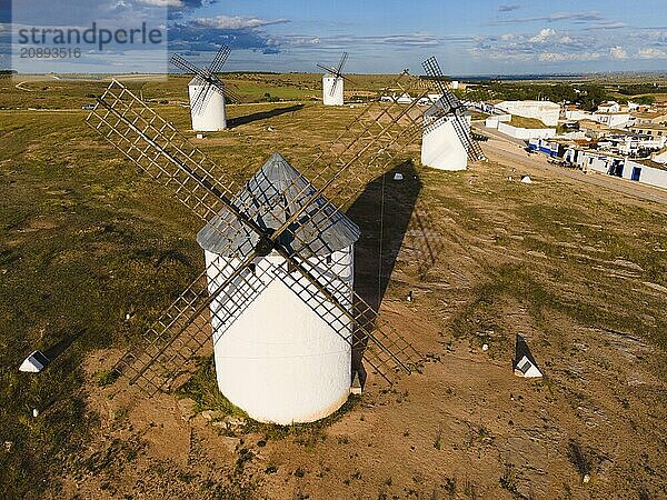 Close-up of several windmills in a green landscape under a blue sky with clouds  aerial view  windmills  Campo de Criptana  Ciudad Real province  Castilla-La Mancha  Route of Don Quixote  Spain  Europe