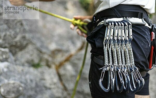 A climber ties himself into a rope to climb on the rock  Morsbach  09.07.2024