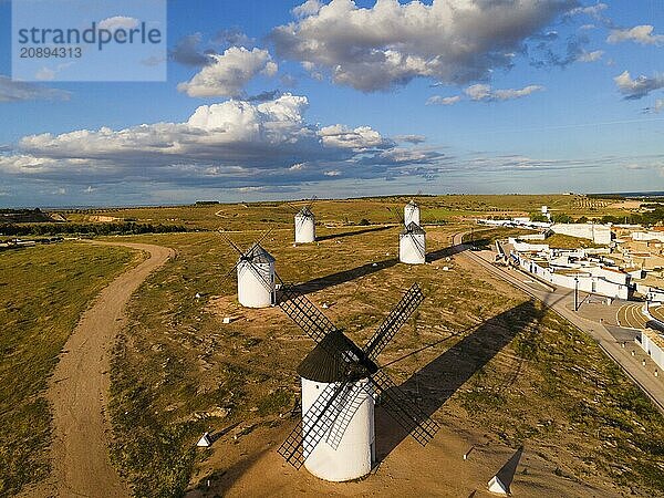 Several windmills in an open field on a sunny day with a few clouds in the sky  aerial view  windmills  Campo de Criptana  Ciudad Real province  Castilla-La Mancha  Route of Don Quixote  Spain  Europe