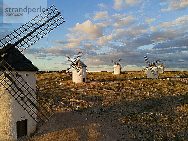 Several windmills in a rural landscape under a slightly cloudy evening sky  aerial view  windmills  Campo de Criptana  Ciudad Real province  Castilla-La Mancha  Route of Don Quixote  Spain  Europe