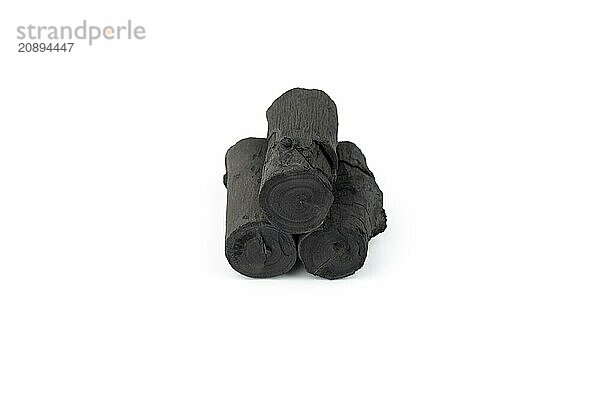 Natural wood charcoal isolated on white background. Pile of coal isolated on white background