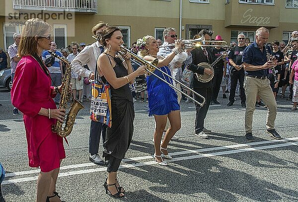 Jazz musicians  The Carling family  play on the street in Ystad in the opening of the Ystad Jazz Festival 2024  Skåne County  Sweden  Scandinavia  Europe