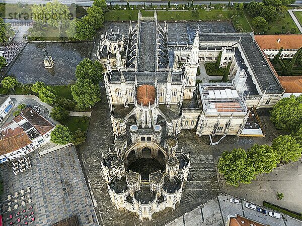 Aerial view of a Gothic abbey with elaborate architecture surrounded by trees and squares  aerial view  monastery  Mosteiro de Santa Maria da Vitória  unfinished chapels  UNESCO World Heritage Site  Batalha  Leiria  Estremadura  Portugal  Europe