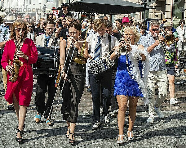 Jazz musicians  The Carling family  play on the street in Ystad in the opening of the Ystad Jazz Festival 2024  Skåne County  Sweden  Scandinavia  Europe