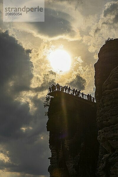 The Bastei is a rock formation with a viewing platform in Saxon Switzerland on the right bank of the River Elbe in the municipality of Lohmen between the spa town of Rathen and the town of Wehlen. It is one of the most visited tourist attractions in Saxon Switzerland. Dramatic sky over the Bastei. ourists on the new viewing platform  Saxon Switzerland  Rathen  Saxony  Germany  Europe