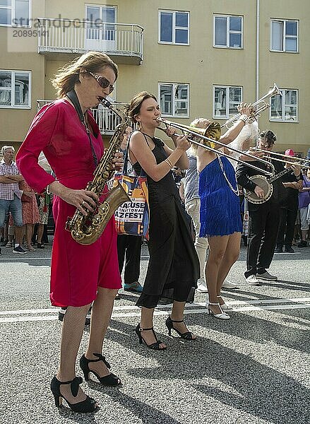 Jazz musicians  The Carling family  play on the street in Ystad in the opening of the Ystad Jazz Festival 2024  Skåne County  Sweden  Scandinavia  Europe