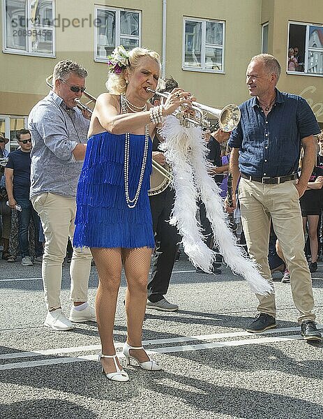 Jazz musicians  The Carling family  play on the street in Ystad in the opening of the Ystad Jazz Festival 2024  Skåne County  Sweden  Scandinavia  Europe