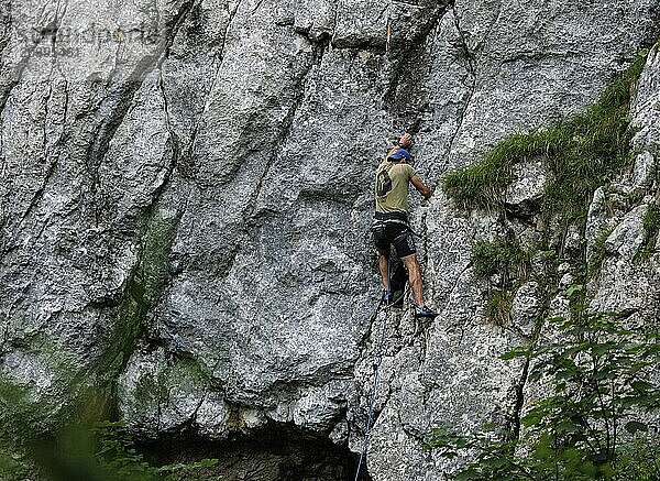 A man climbs a route on the Spitzsteinwand in Erl  14.07.2024