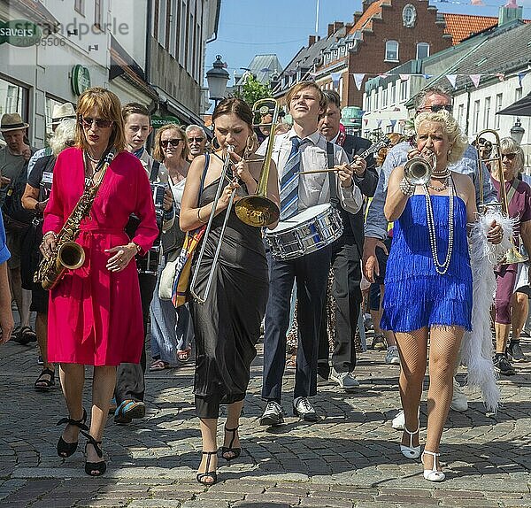 Jazz musicians  The Carling family  play on the street in Ystad in the opening of the Ystad Jazz Festival 2024  Skåne County  Sweden  Scandinavia  Europe