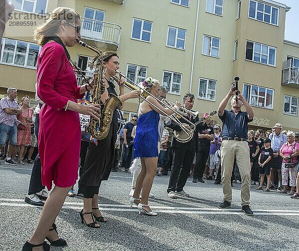 Jazz musicians  The Carling family  play on the street in Ystad in the opening of the Ystad Jazz Festival 2024  Skåne County  Sweden  Scandinavia  Europe