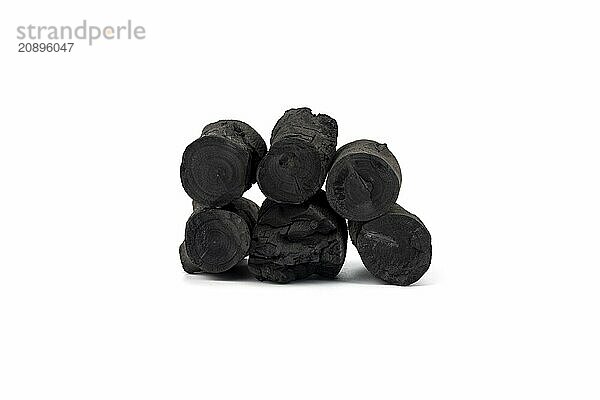 Natural wood charcoal isolated on white background. Pile of coal isolated on white background