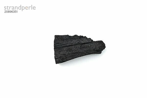 Natural wood charcoal isolated on white background. Pile of coal isolated on white background