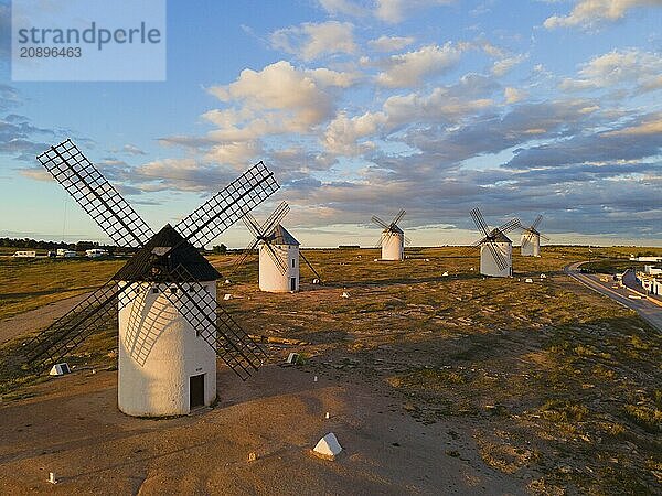 Several windmills are scattered in a wide landscape under a slightly cloudy sky  aerial view  windmills  Campo de Criptana  Ciudad Real province  Castilla-La Mancha  Route of Don Quixote  Spain  Europe