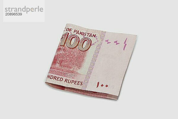 Currency notes in Pakistani Rupees  100 rupees note on white background