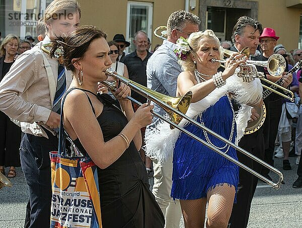 Jazz musicians  The Carling family  play on the street in Ystad in the opening of the Ystad Jazz Festival 2024  Skåne County  Sweden  Scandinavia  Europe