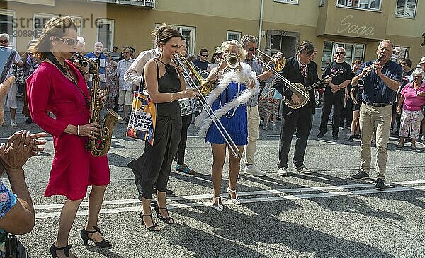 Jazz musicians  The Carling family  play on the street in Ystad in the opening of the Ystad Jazz Festival 2024  Skåne County  Sweden  Scandinavia  Europe